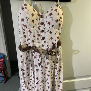 White dress, belt has a flower design, size 6.